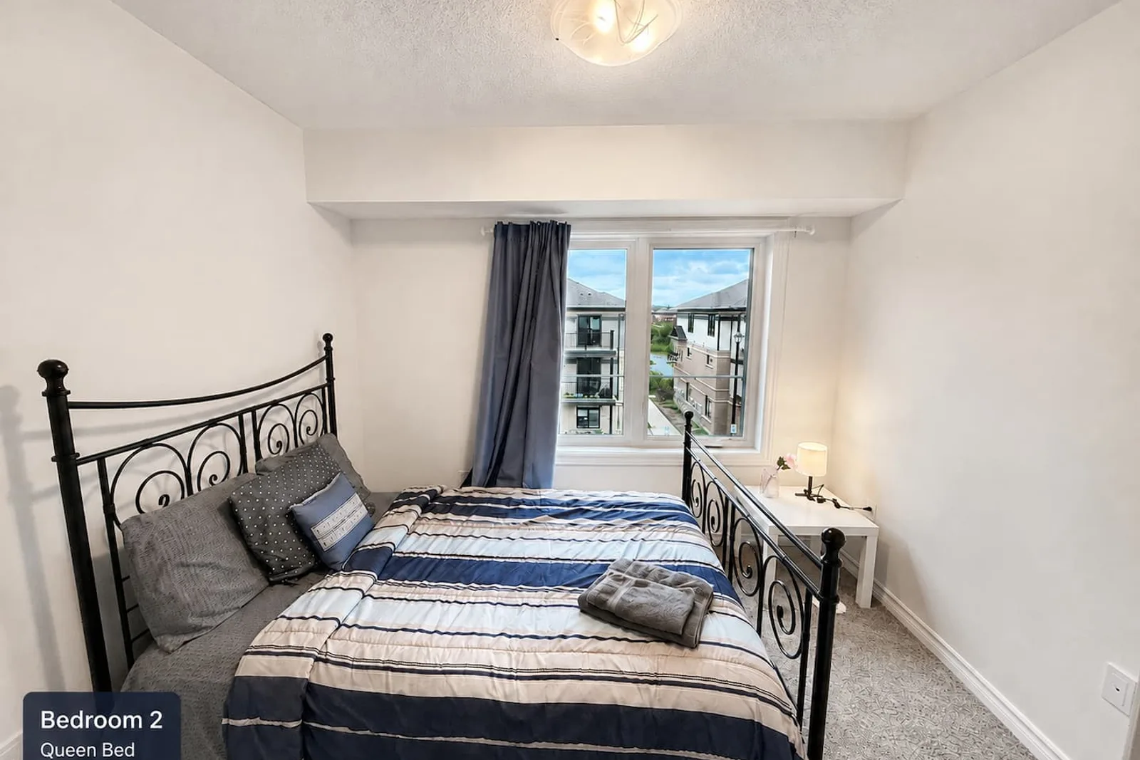 Second bedroom with a double bed and clothing storage
