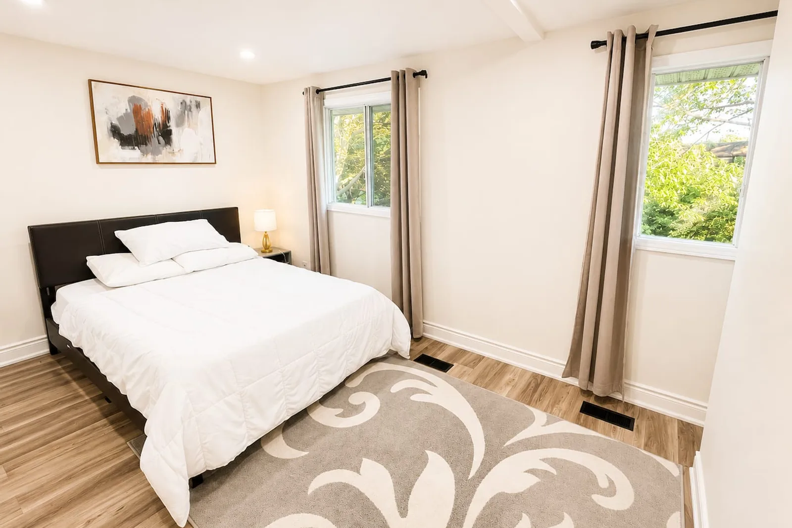 First bedroom with a queen bed